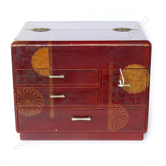 Dark red lacquer. Half hinged lid above 4 drawers. Gilt chrysanthemum decoration. 320 x 220 x 250mm