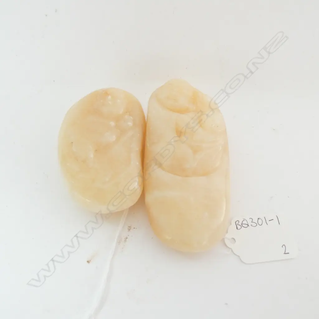 PAIR OF HANDLING STONES WITH CARVED BUDDAH, L 95MM Image 1++