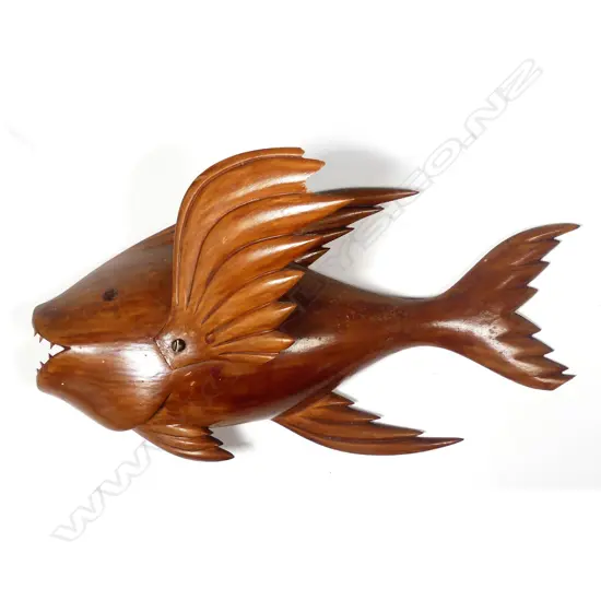 An uncommon Pitcairn Island carved wooden wall mounting flying fish
