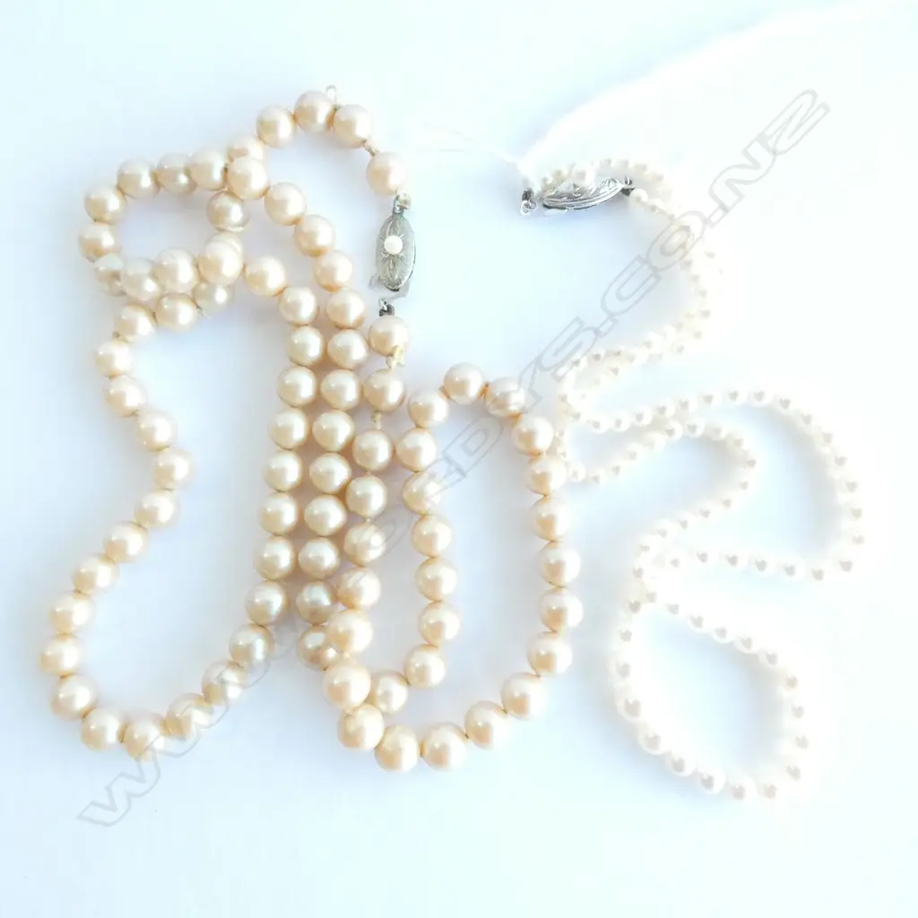 STRING OF CULTURED PEARLS - SILVER CLASP PLUS ONE OTHER. Image 1++