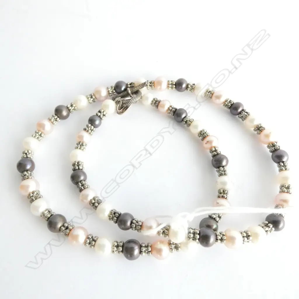 A STRING OF KATALI LUSTER AND BLACK PEARLS WITH STERLING SILVER DIVIDERS AND CLASP  Image 1++
