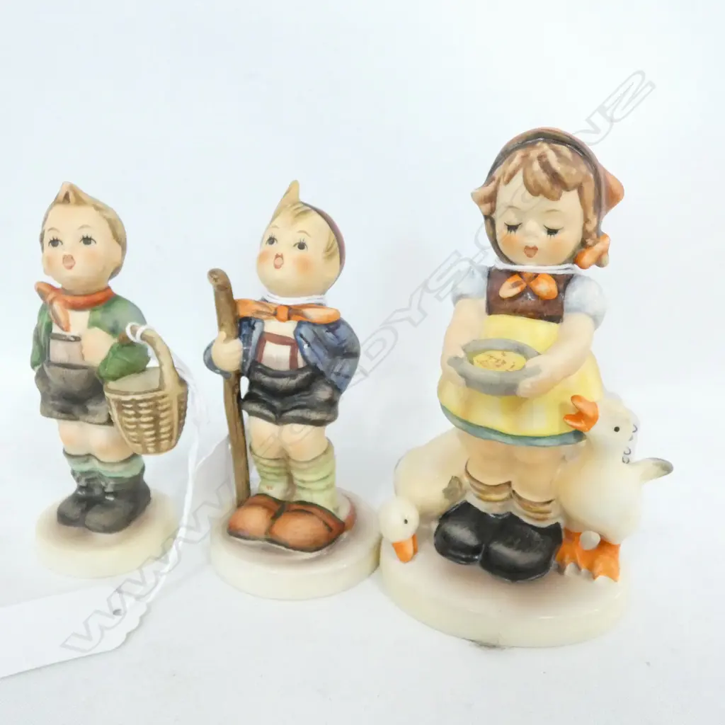 THREE HUMMEL FIGURES; FEEDING TIME GIRL, LITTLE HIKER, VILLAGE BOY, TALLEST 115MM Image 1++