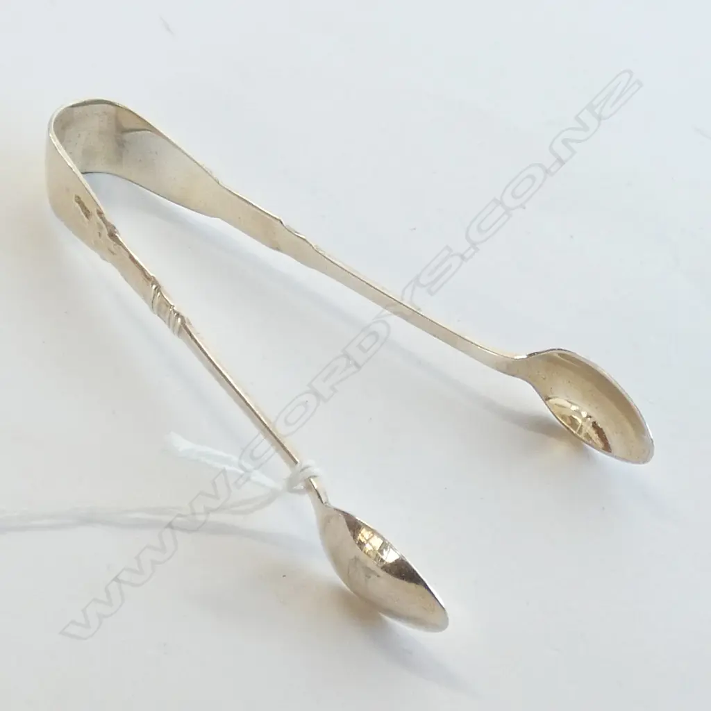 SIL. PLATED SUGAR TONGS WITH RELIGIOUS ICON Image 1++