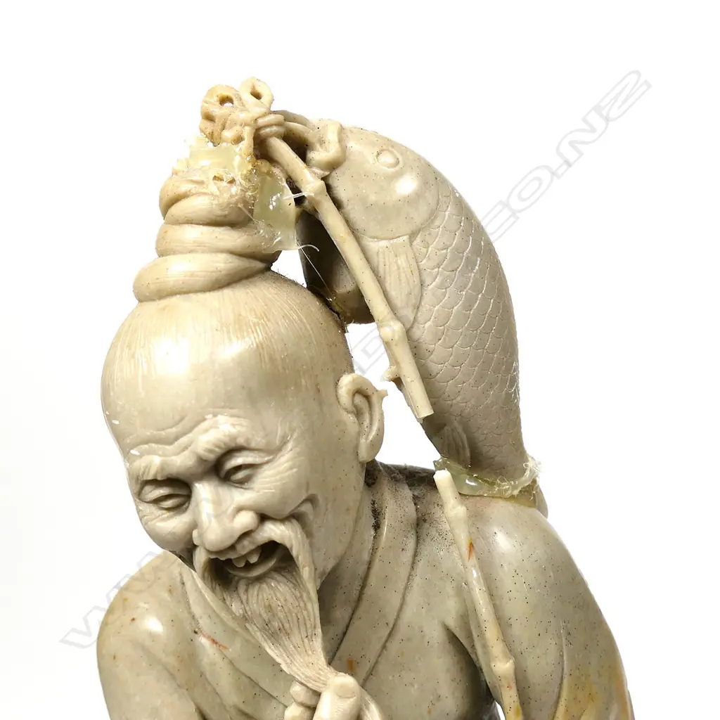 ORIENTAL CARVED HARDSTONE FIGURE OF FISHERMAN WITH FISH & POLE,  FAULTS, H. 410MM Image 1++