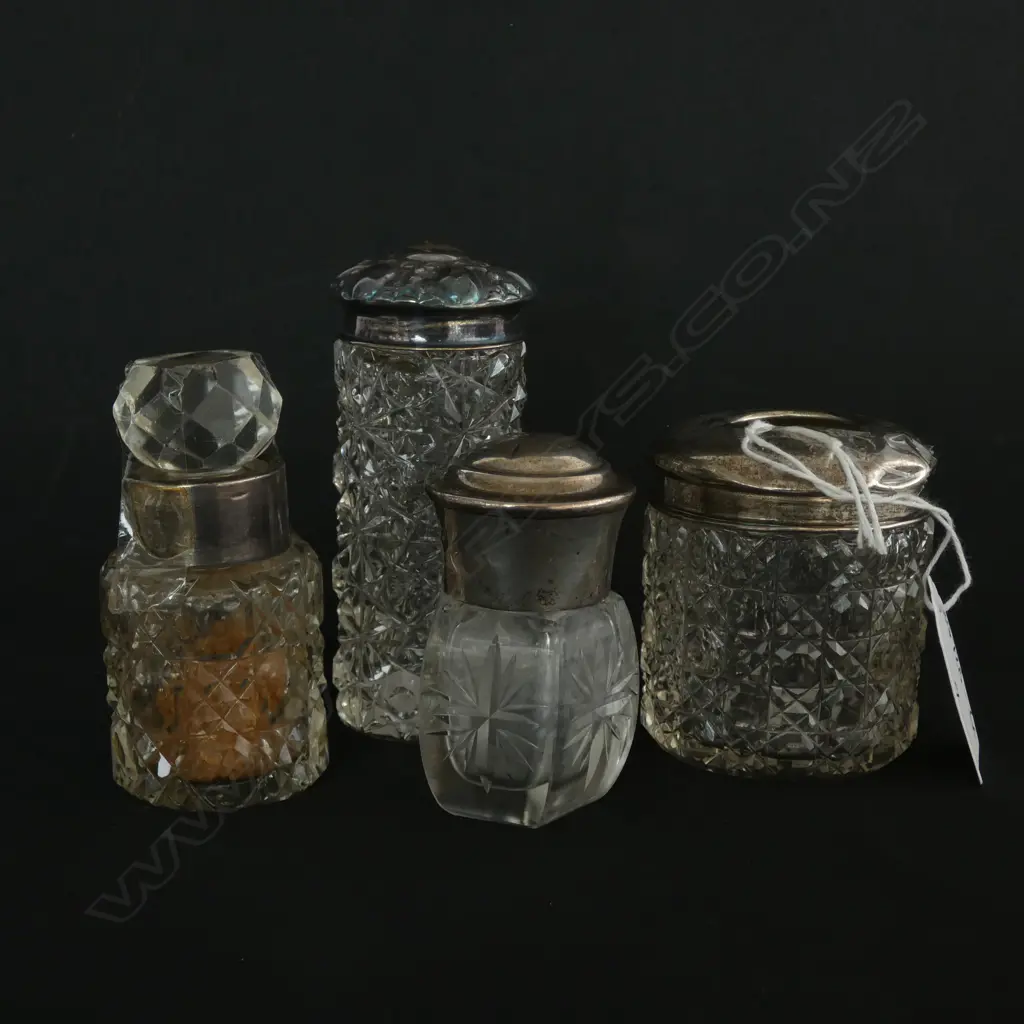 4 SILVER TOPPED SCENT BOTTLES  Image 1++