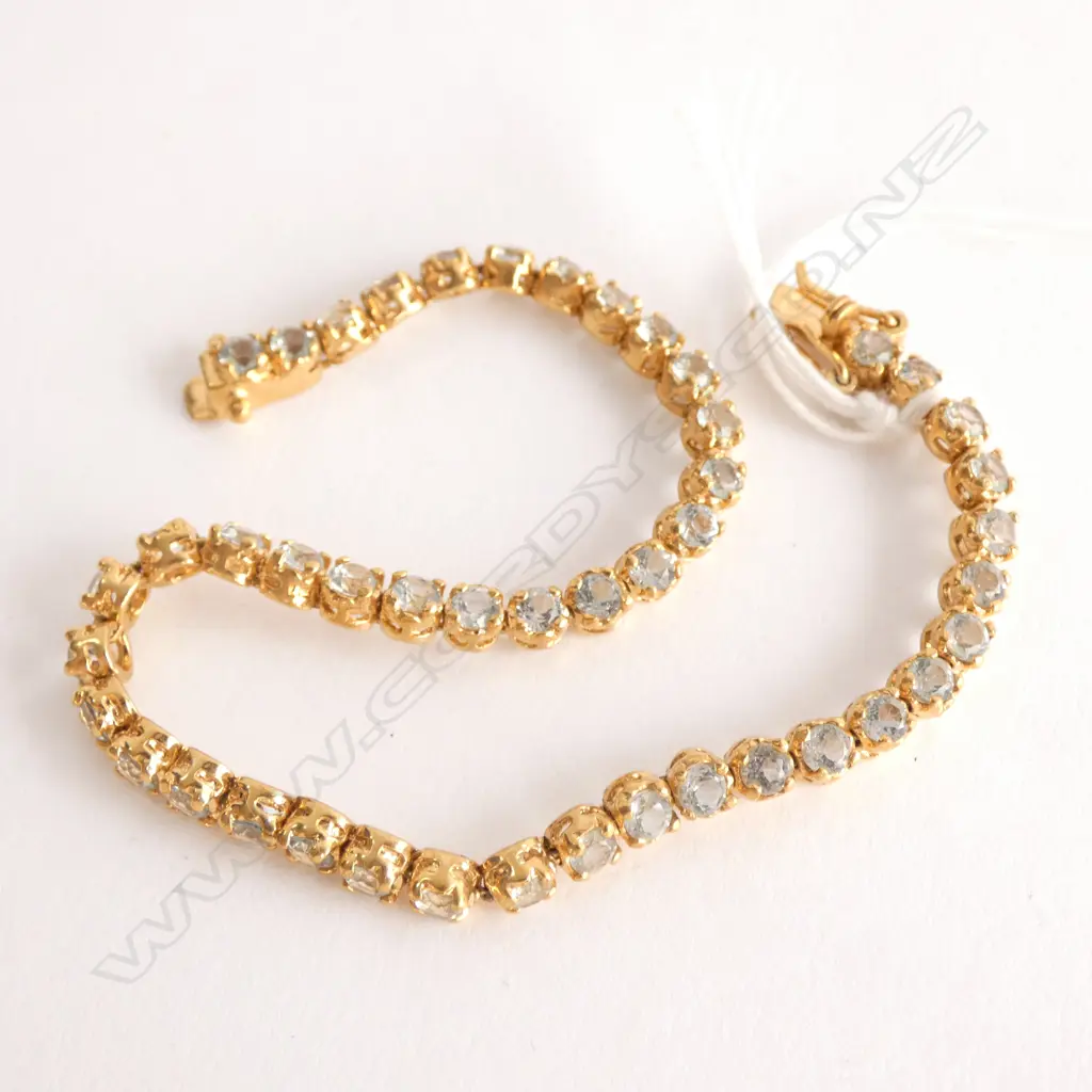 18CT GOLD PLATED AND AQUAMARINE TENNIS BRACELET (LOW GRADE AQUAMARINES) Image 1++