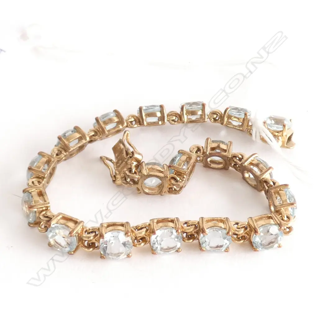 18CT GOLD PLATED AND AQUAMARINE TENNIS BRACELET (LOW GRADE AQUAMARINES) Image 1++
