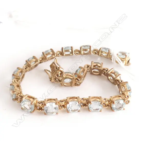 18CT GOLD PLATED AND AQUAMARINE TENNIS BRACELET (LOW GRADE AQUAMARINES)