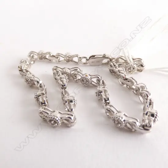 SILVER AND DIAMOND SET BRACELET ONE MISSING