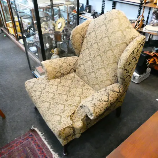UPHOLSTERED WING BACK ARMCHAIR