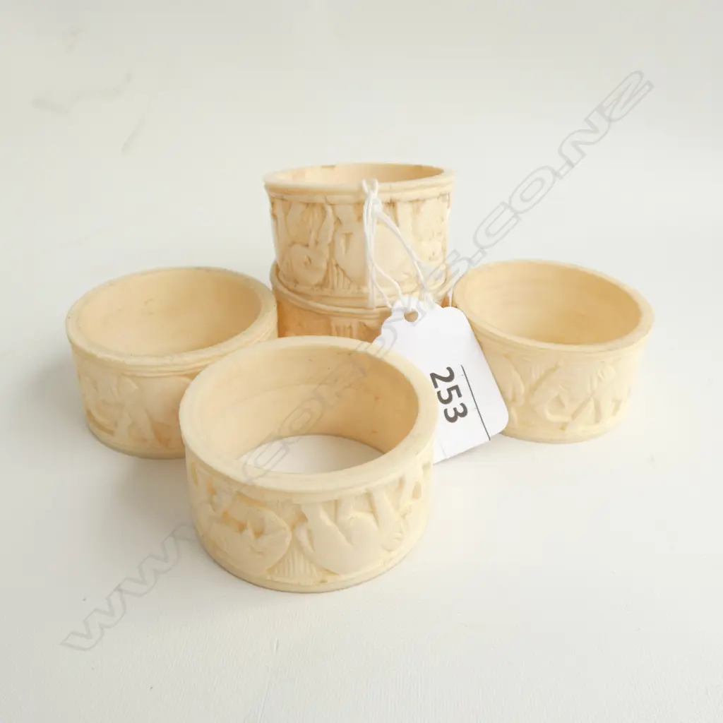 5 CARVED IVORY NAPKIN RINGS Image 1++