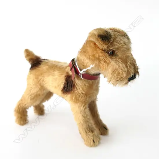 1317.0. With red leather collar; tag and button to ear.