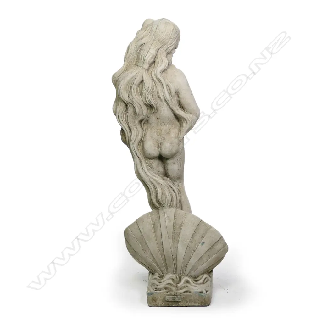 A classical garden statue of a naked maiden 'Shell Girl', finely cast concrete, she stands within a shell, her long hair providing some modesty. H.865mm. Image 1++