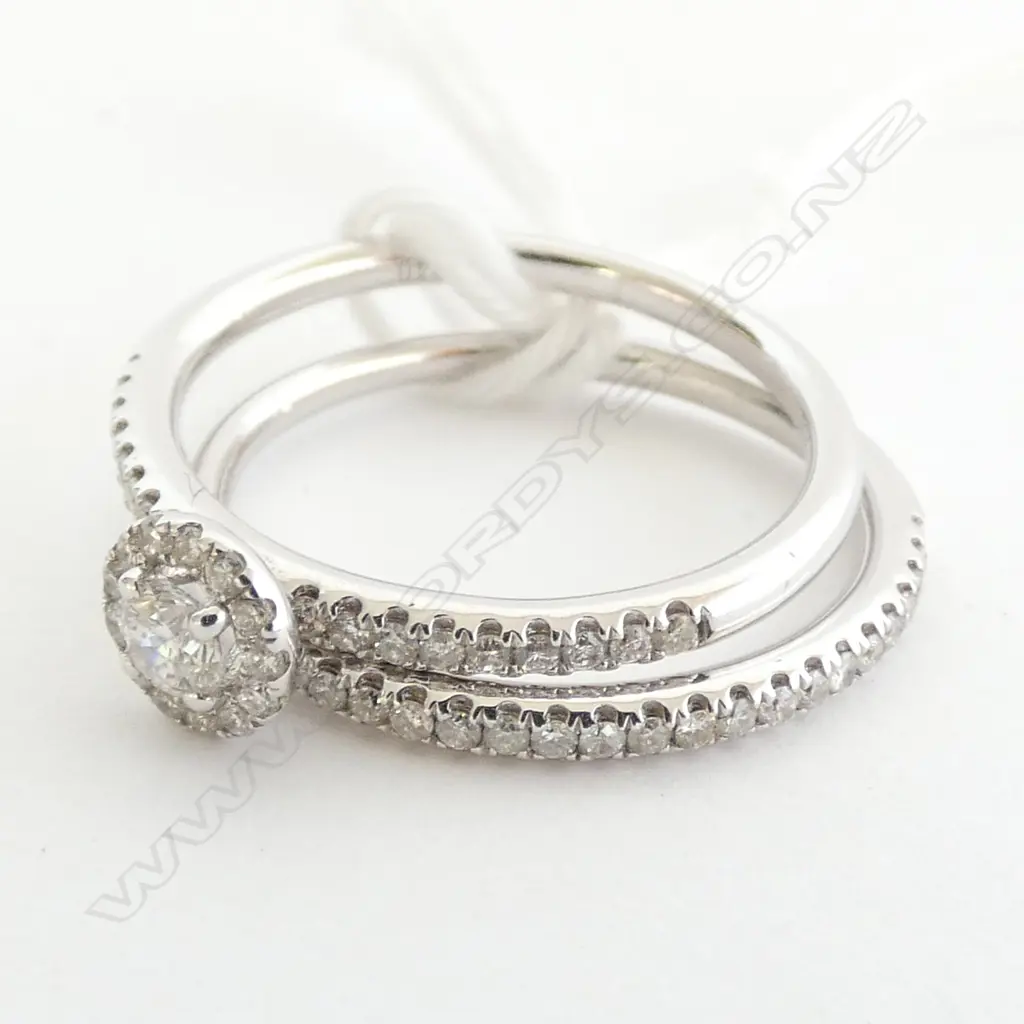 PAIR 18CT WHITE GOLD AND DIAMOND RINGS Image 1++