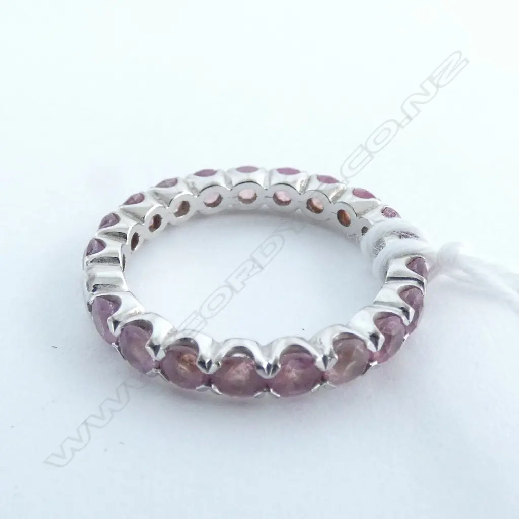 18CT WHITE GOLD AND PINK SAPPHIRE BAND (VALUATION) Image 1++