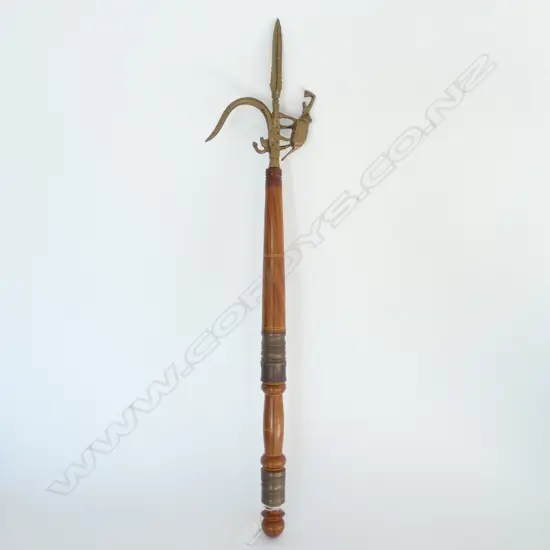 INDIAN BRASS & TEAK HOOKED IMPLEMENT WITH ELEPHANT DECORATION L 600MM