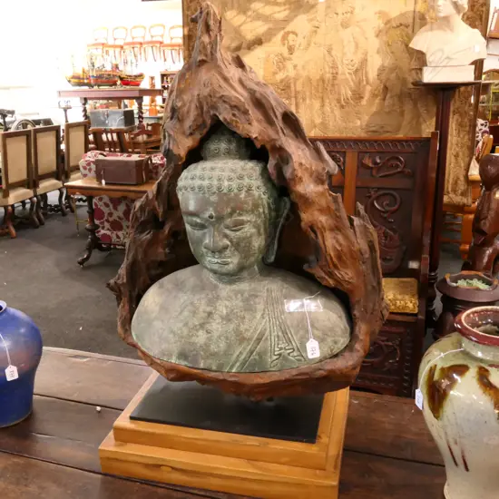 BRONZE BUDDHA HEAD IN GNARLED WOOD GROTTO 950MM H