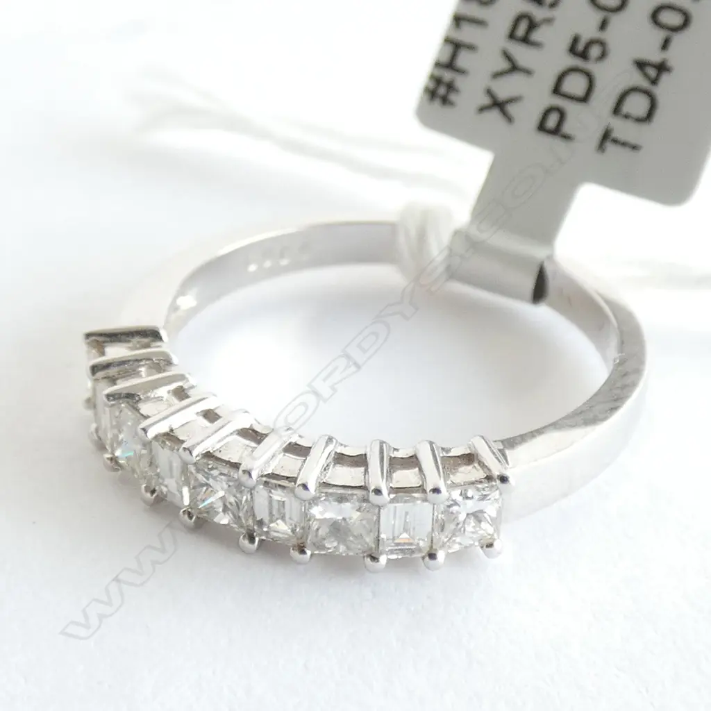 18CT WHITE GOLD AND DIAMOND SET BAND TDW 0.60ct Image 1++