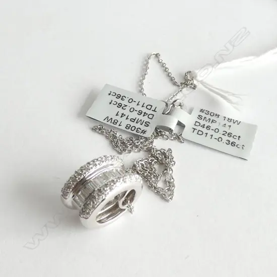 18ct WHITE GOLD AND DIAMOND PENDANT ON SILVER CHAIN TDW 0.64ct