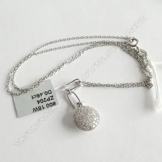 18CT WHITE GOLD AND DIAMOND PENDANT ON SILVER CHAIN TDW 0.46ct
