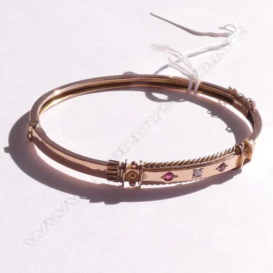 EDWARDIAN 9CT ROSE GOLD DIAMOND AND RUBY BANGLE
