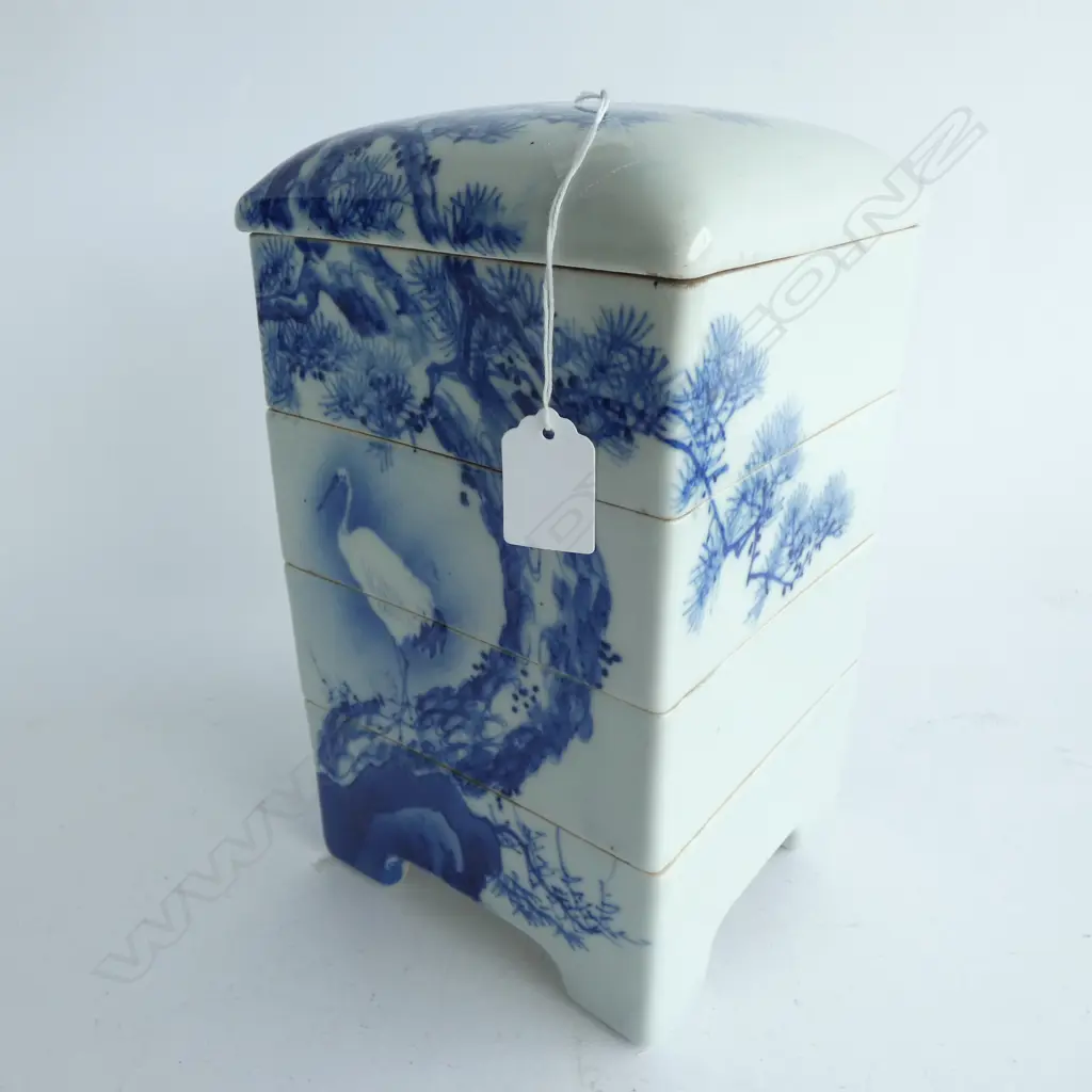 MEIJI-PERIOD 5 SECTION IMARI ‘JU-BAKO’ FOOD PRESENTATION BOX. hand painted in blue & white. A ‘Tsuru’  Crane is perched on the base of an artfully rendered ‘Akamatsu’  Red Pine Image 1++