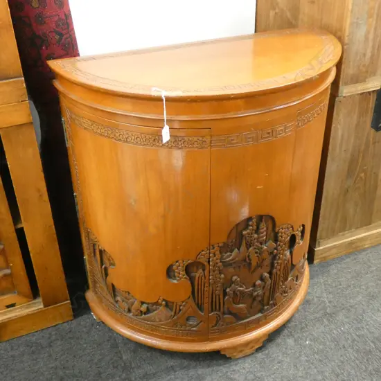 CARVED CHINESE CAMPHOR DEMILUNE DRINKING CABINET...