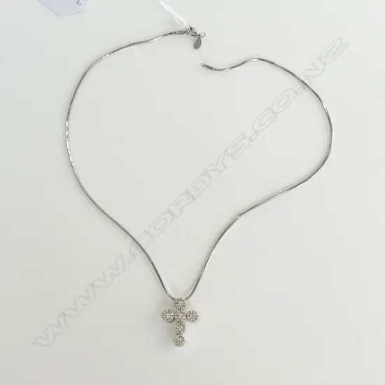 UNMARKED GOLD AND DIAMOND SET CROSS (WITH WHITE METAL CHAIN)