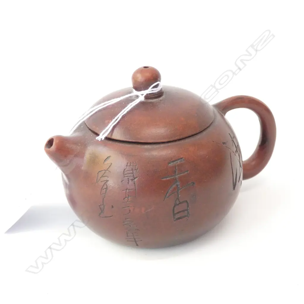 CHINESE YIXING TEAPOT WITH INCISED CALIGRAPHY Image 1++