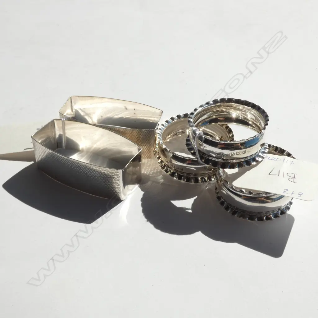 3 SILVER NAPKIN RINGS, B'HAM 1904 + 2 MARKED STERLING SILVER. TOTAL 56gm Image 1++