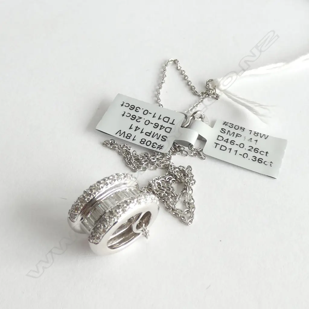 18ct WHITE GOLD AND DIAMOND PENDANT ON SILVER CHAIN TDW 0.64ct Image 1++