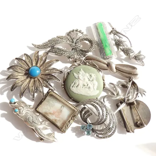 11 SILVER  BROOCHES  PLUS ONE OTHER
