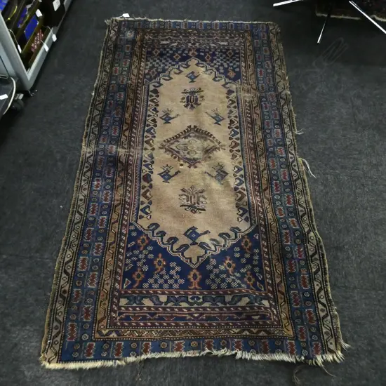 HAND KNOTTED BLUE PERSIAN RUG 970 X 1830MM - THREADBARE IN CENTRE - WEAR TO ENDS
