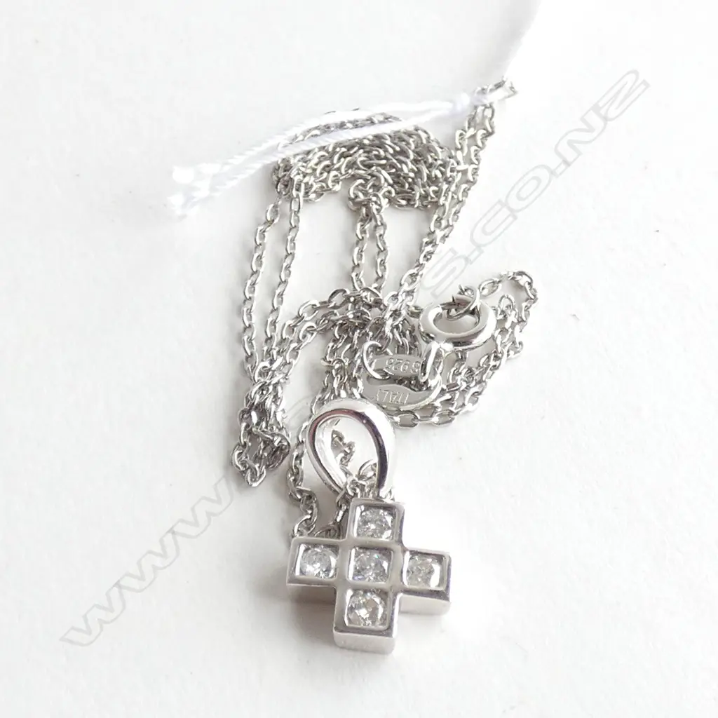 An 18ct white gold and diamond pendant, Image 1++