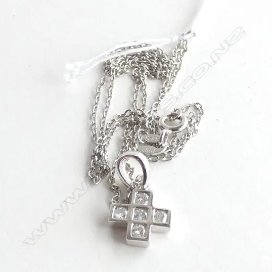 An 18ct white gold and diamond pendant,