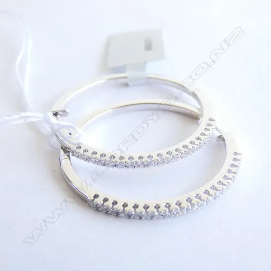 A pair of 18ct white gold and diamond hoop earrings,