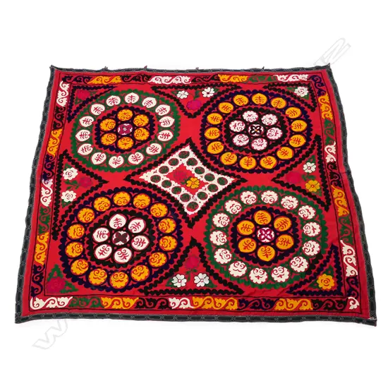 AN UZBEKISTANI SUZANI TEXTILE DECORATED WITH COLOURFUL CHAIN STITCH