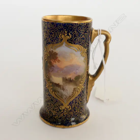 The loch and castle hand painted cartouche on cobalt ground with gilt scrolling