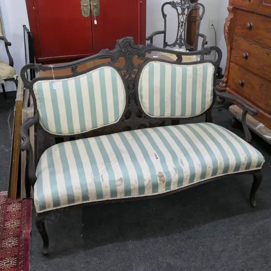 AN EDWARDIAN 2 SEATER SOFA COVER A/F