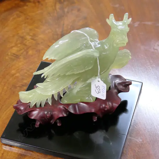 CHINESE CARVED CHRYSOPRASE DRAGON ON WOODEN STAND