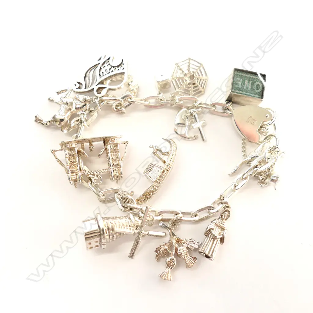 SILVER CHARM BRACELET WITH 13 CHARMS 62gm Image 1++