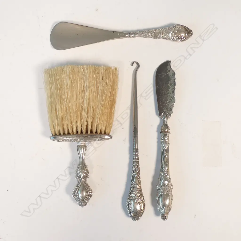 4 STG SILVER PCES; CLOTHES BRUSH, GLOVE HOOK, BUTTER KNIFE AND SHOE HORN Image 1++