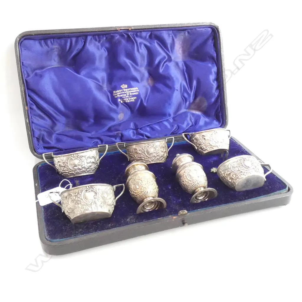 A late Victorian seven-piece cased silver horse-racing club prize condiment set Image 1++