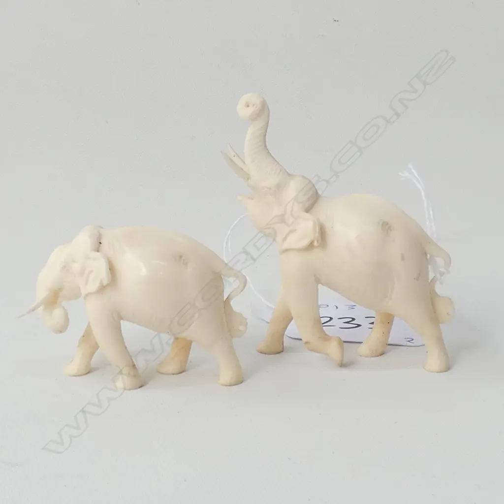 2 SMALL IVORY ELEPHANTS, ONE TRUNK UPWARDS Image 1++
