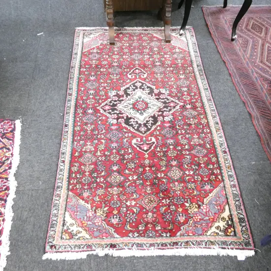 HAND KNOTTED SINGLE BOARDER WITH DIAMOND MEDALLION CENTRE ON HERATI GROUND PERSIAN RUG 1750 X 950MM
