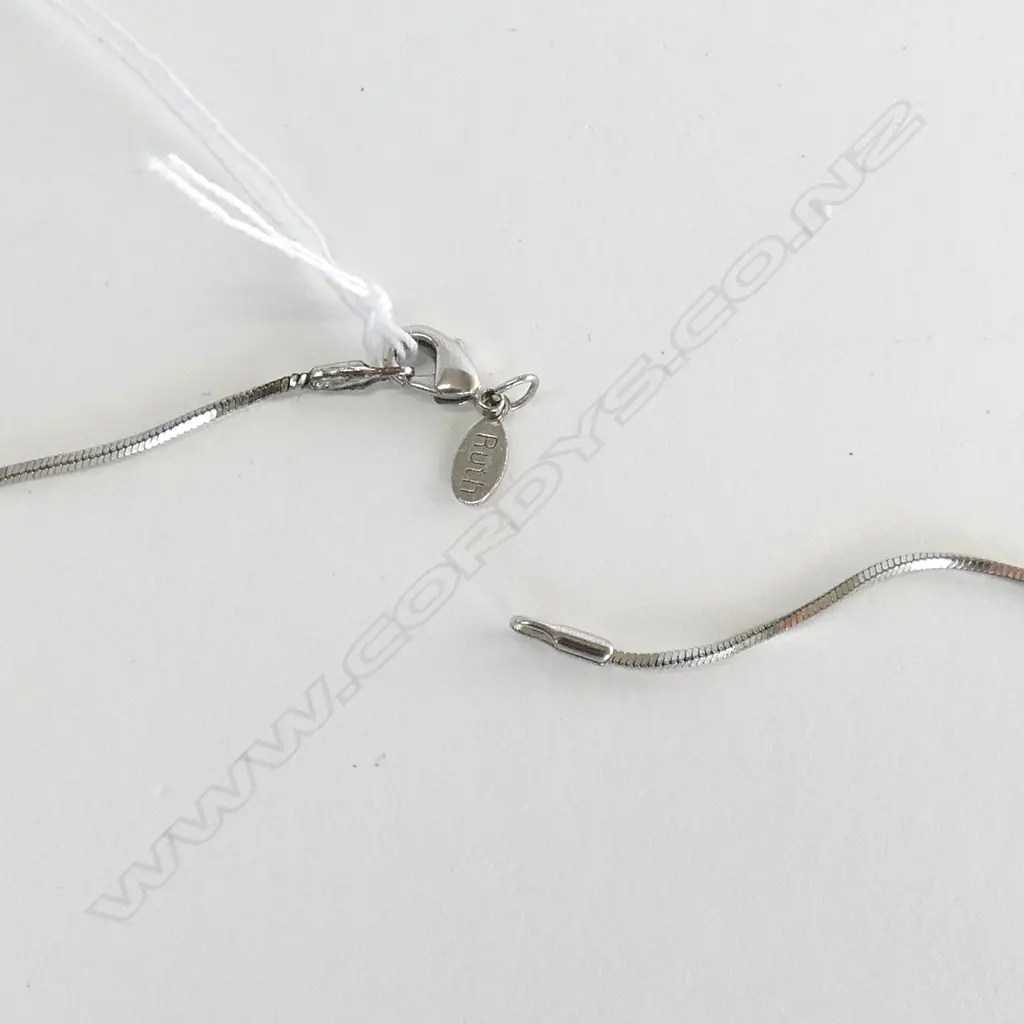 UNMARKED GOLD AND DIAMOND SET CROSS (WITH WHITE METAL CHAIN) Image 1++