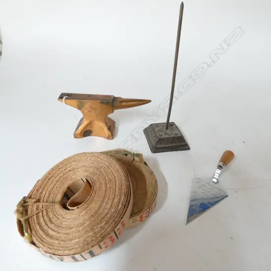 COPPER JEWELLER'S ANVIL, MINI LODGE TROWEL, INVOICE SPIKE & 2 UNUSED MEASURING TAPE INSERTS (5)