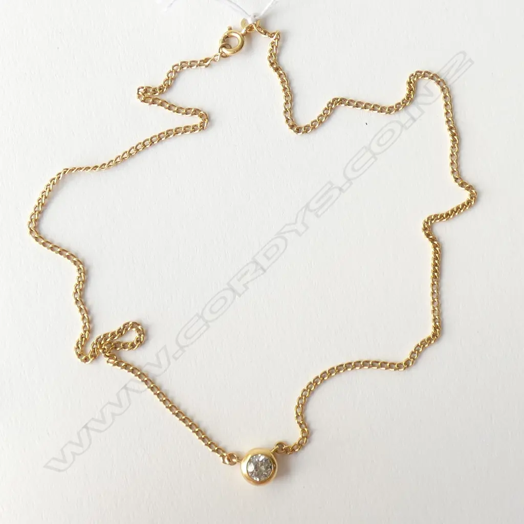 A modern 18ct. yellow gold and diamond pendant necklace Image 1++