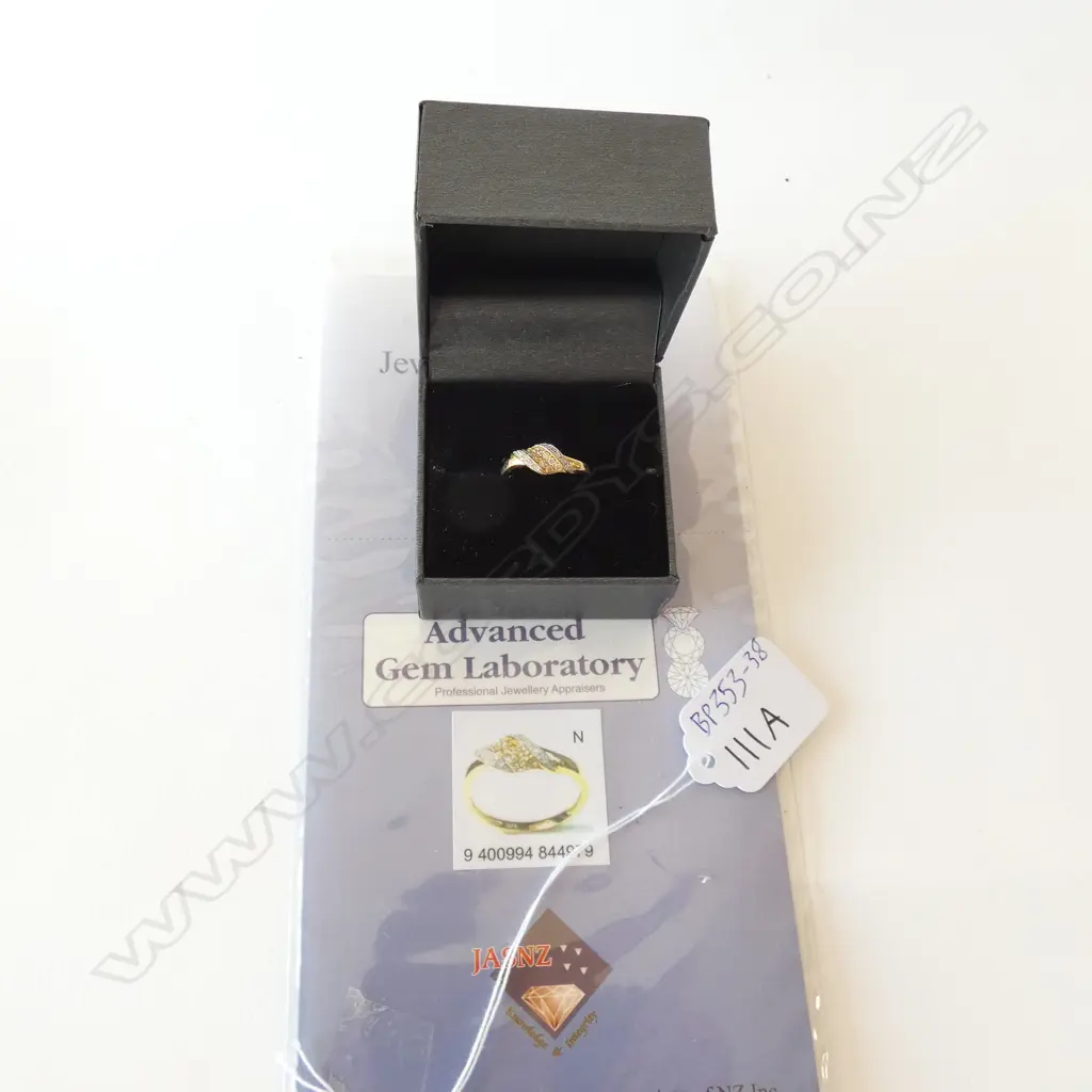 9CT GOLD & .21CT DIAMOND CROSSOVER RING, WITH VALUATION ($700) Image 1++