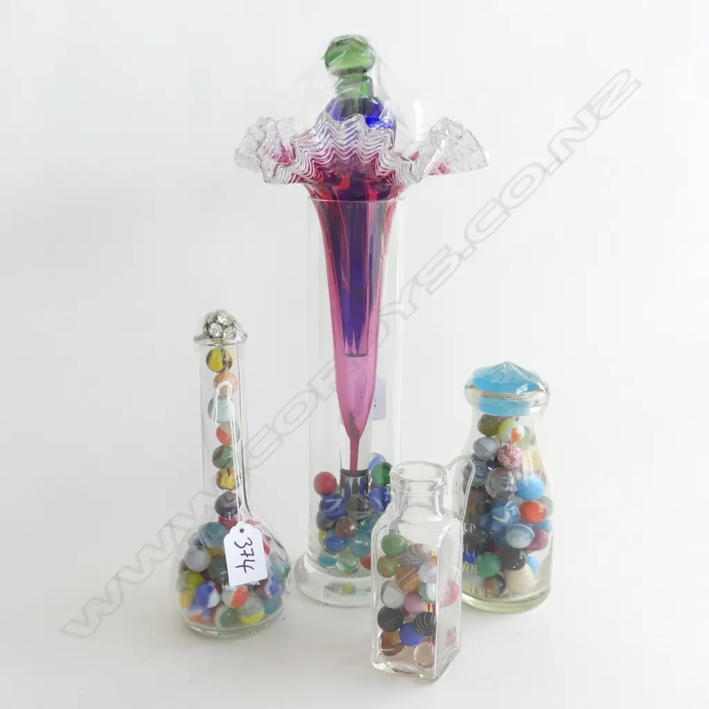 (53) 4 GLASS BOTTLES OF MARBLES Image 1++